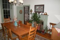 View of dining room table and fireplace